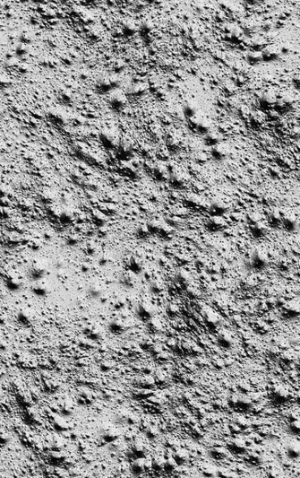 Nahaufnahme einer rauen, unregelmäßig strukturierten Betonoberfläche. Die Oberfläche ist von kleinen Erhebungen, Vertiefungen und feinen Poren durchzogen, wodurch ein körniges, fast mondlandschaftartiges Relief entsteht. Die Textur wirkt trocken und kontrastreich.

                                    